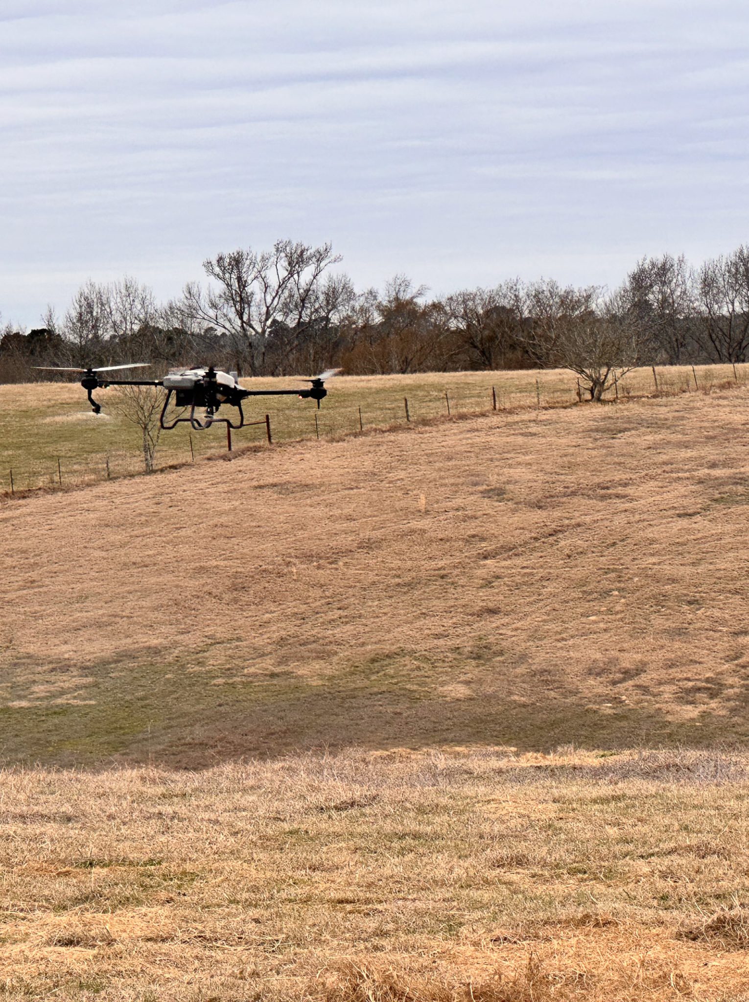 Four-panel aerial drone view of East Texas farmland, pastures, pond, and GPS-mapped land parcel used for agricultural drone spraying planning